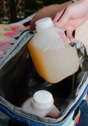 Two small jugs of margarita mix